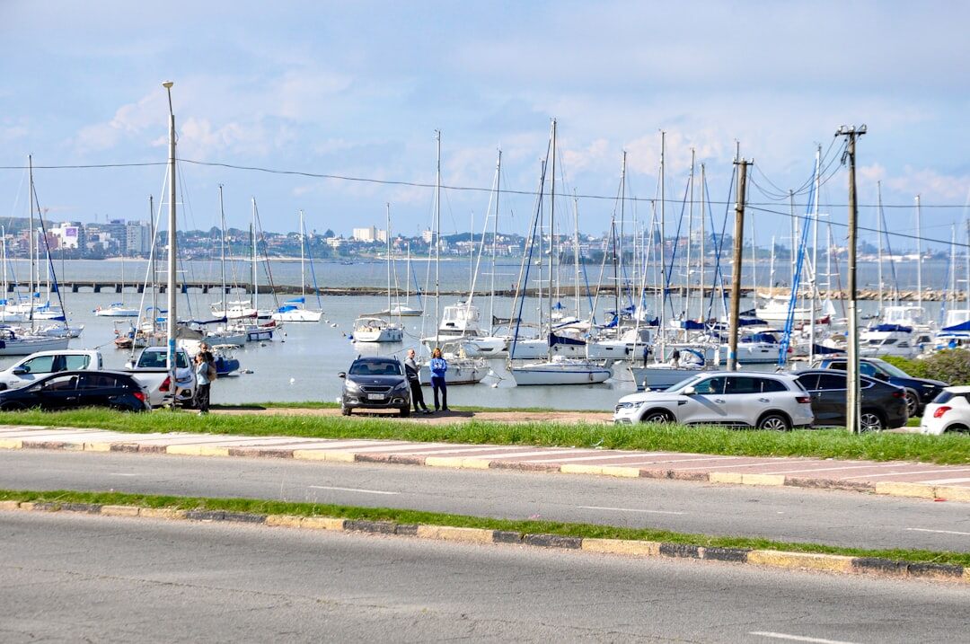 Row of classic convertibles parked near the beach in Punta del Este during summer