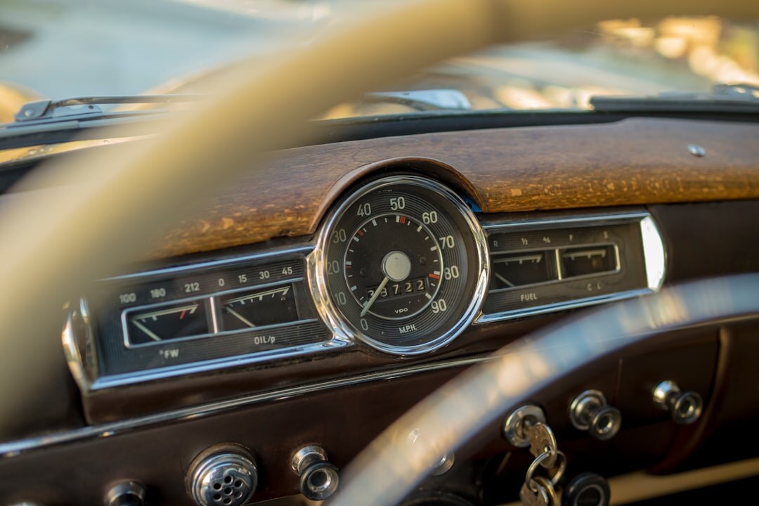 Detailed view of a restored wooden and leather car interior dashboard